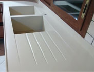 Draining grooves and sink integrated into a Corian worktop