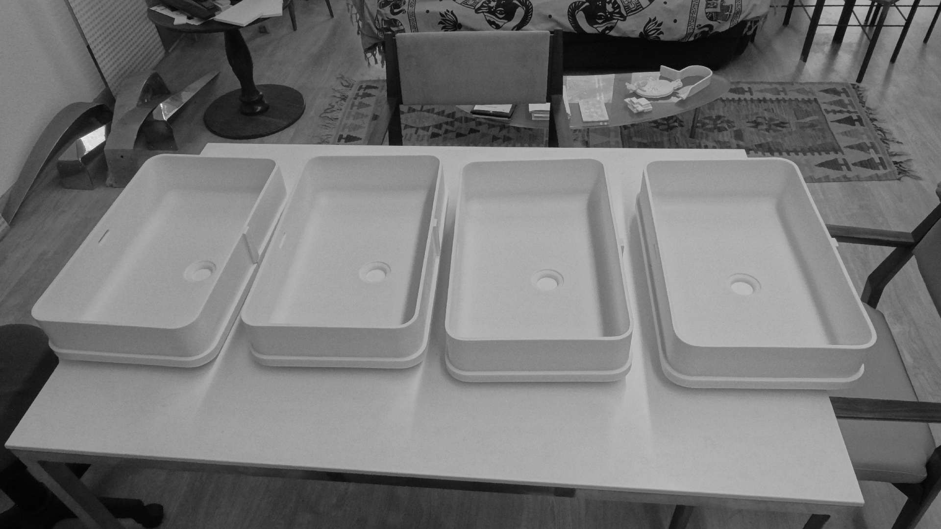 Corian bowls just formed, lined up in the workshop