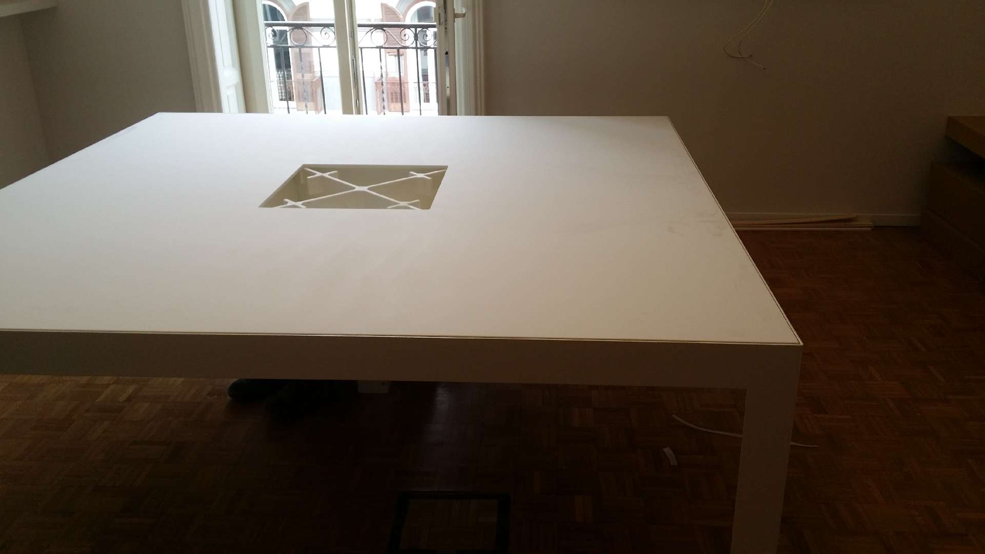 Corian table with a decorative inlay in the top