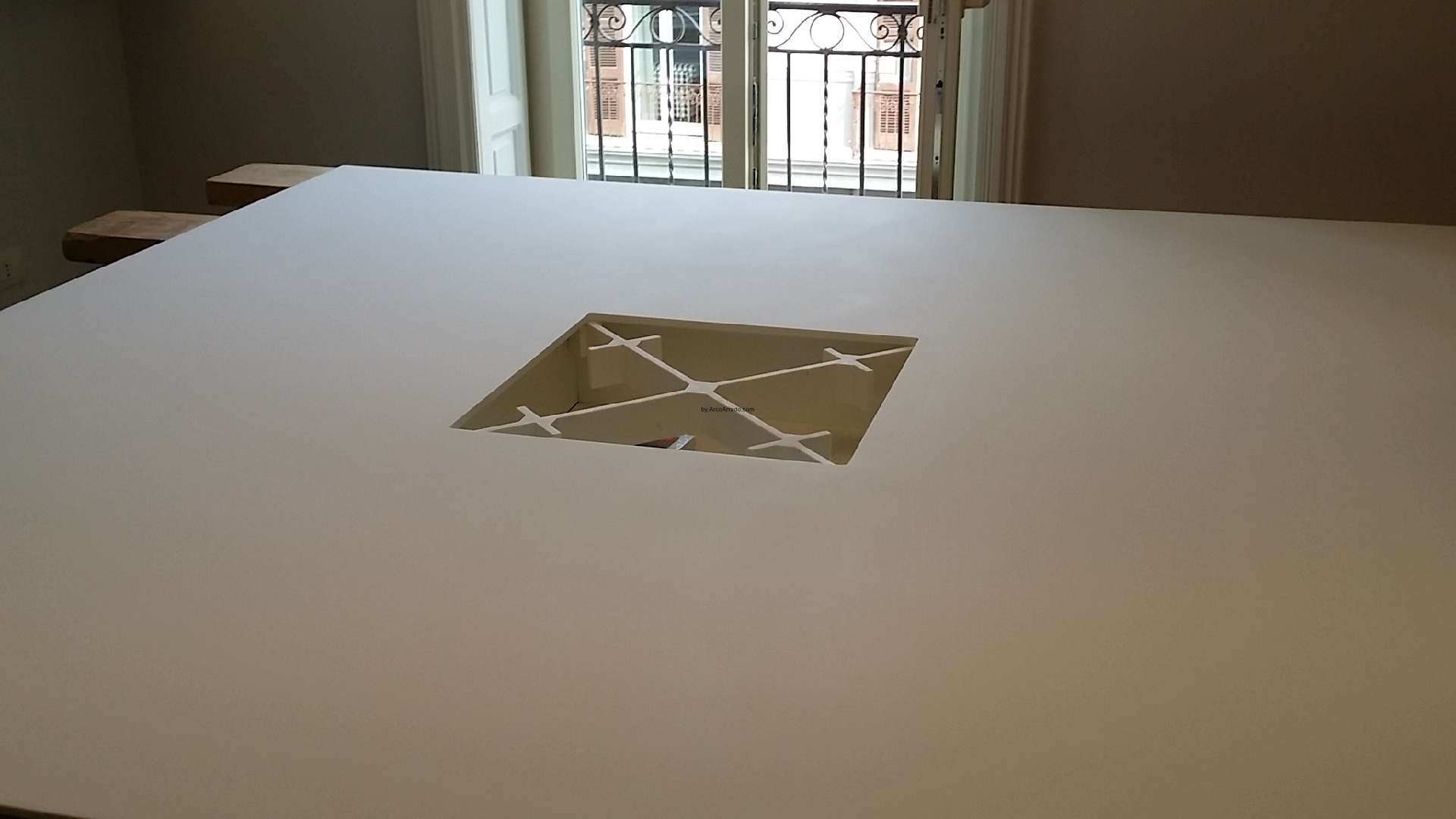 The cable management device at the centre of the Corian top